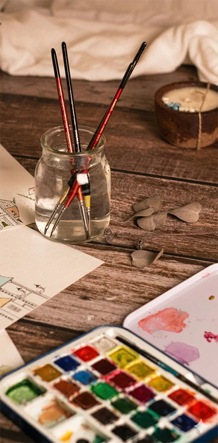 Creative counselling materials, pens, paint and clay